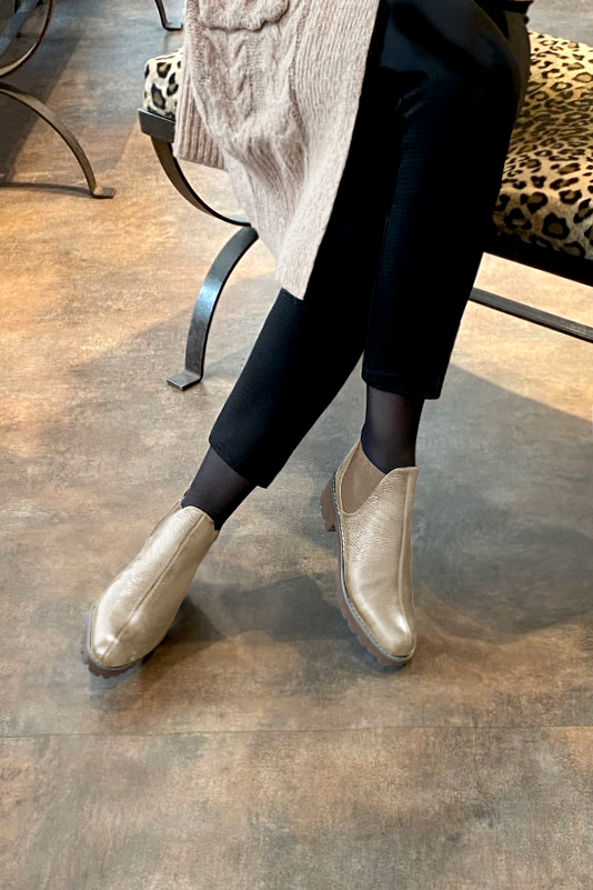 Tan beige women's ankle boots, with elastics. Round toe. Low rubber soles. Worn view - Florence KOOIJMAN